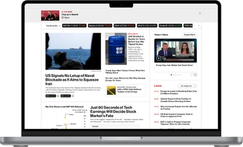 Bloomberg.com financial news portal shown on a laptop